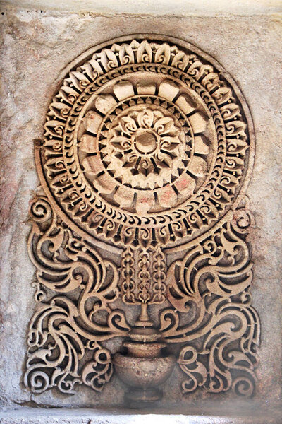 Beautifully etched geometrical pattern in mortar at Adalaj Step Well in Ahmedabad, Gujarath, India, Asia