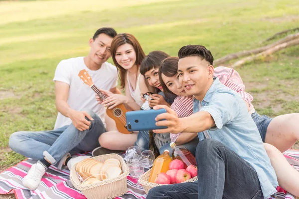 people selfie with his friends in the park