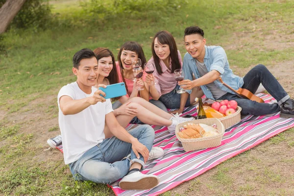 people selfie with his friends in the park