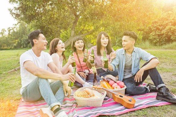 Asian people take a picnic with beer