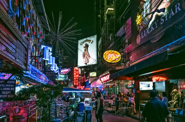 Bangkok, Thailand - Feb 16, 2017: crowded street Soi Cowboy at night, a famous red-light area, one of centers of prostitution and sex tourism in Bangkok city.