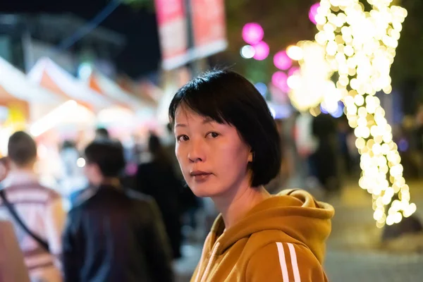 Asian woman face at night — Stock Photo, Image