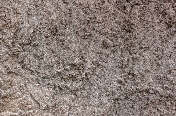 Parede de pedra áspera na cor marrom — Fotografia de Stock