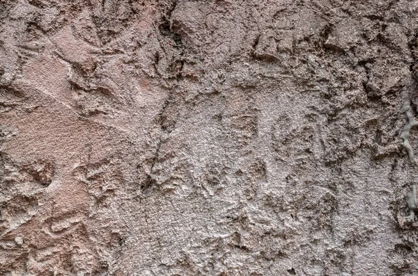 Muro di pietra grezza di colore marrone — Foto Stock