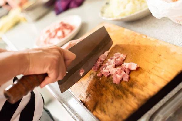 cut raw pork on wooden table