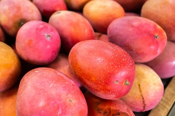red stacks of mango fruits