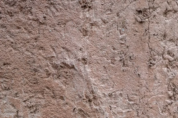 Pared de piedra rugosa en color marrón — Foto de Stock