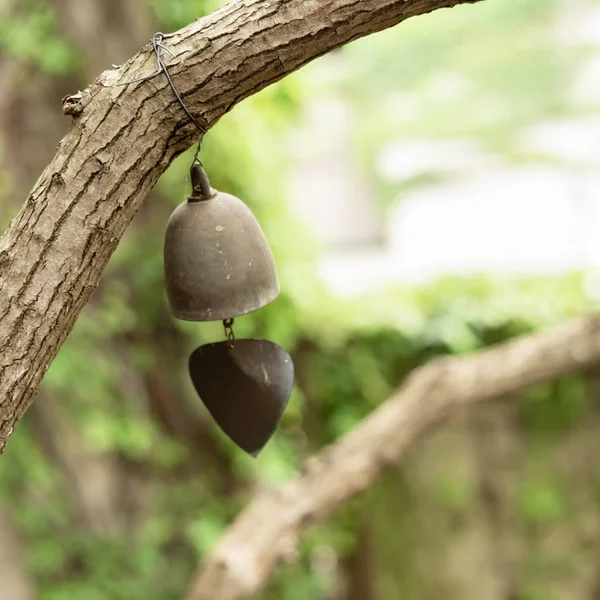 Ancient and retro bell hang on a tree — Stock Photo, Image