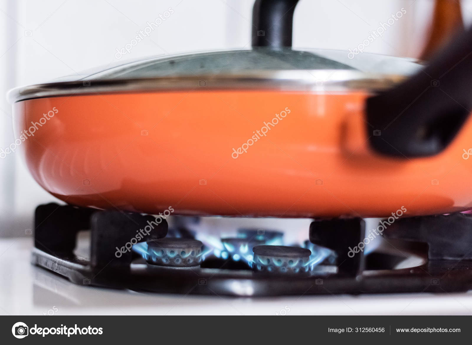 Stove top burner igniting Stock Photo by ©elwynn 312560456
