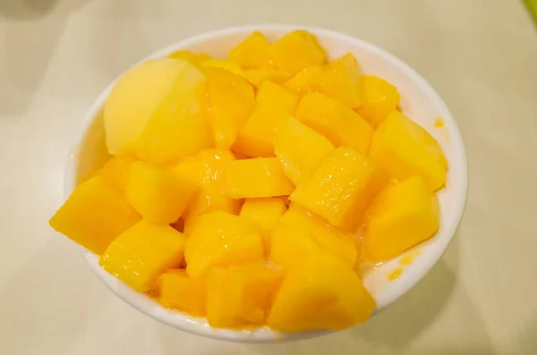 eating mango shaved ice with colorful dessert, famous Taiwanese snacks at Taiwan