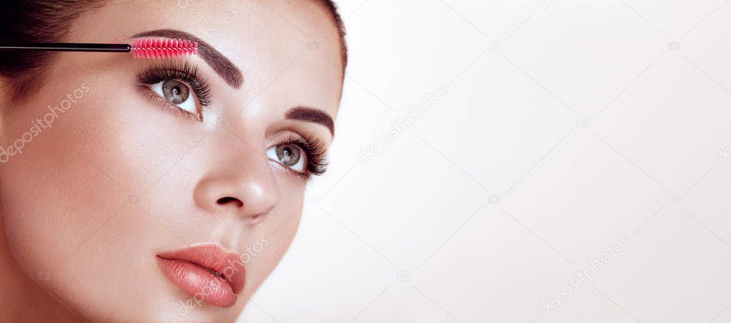Beautiful woman with long false eyelashes