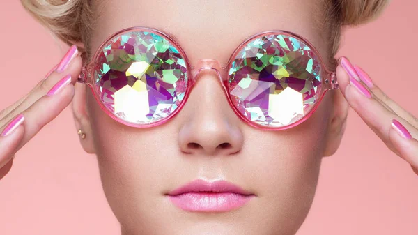 Portrait of beautiful young woman with colored glasses — Stock Photo, Image