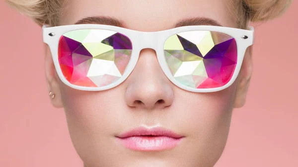 Portrait of beautiful young woman with colored glasses — Stock Photo, Image