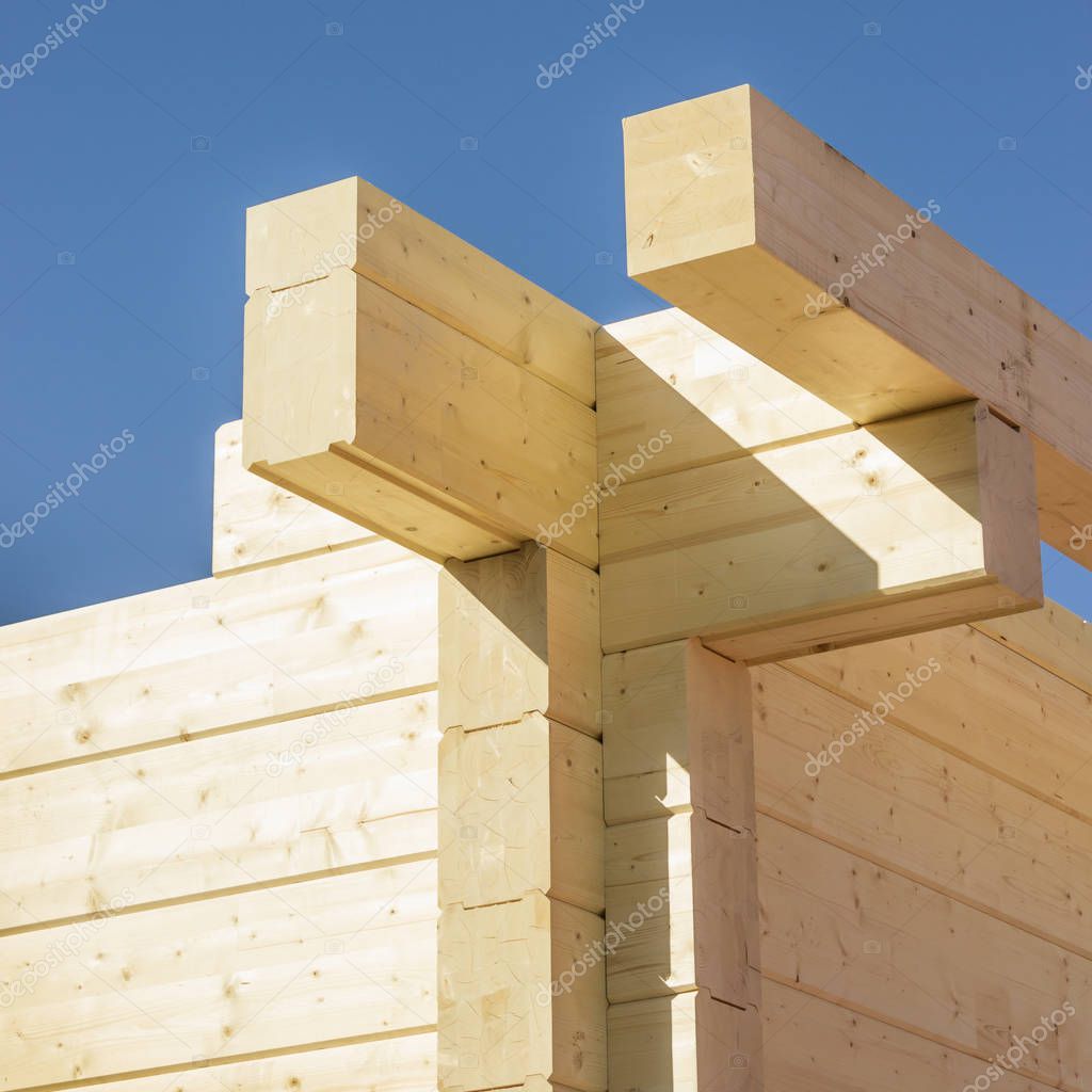 Construction of a building made of glued beams. Angle of log house