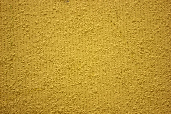 Texture de fond jaune.Plâtre de façade peint avec pai jaune — Photo