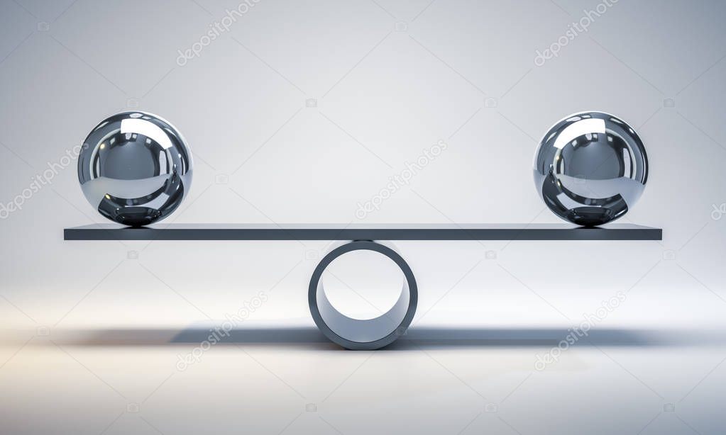 chrome balls on scale on grey background 