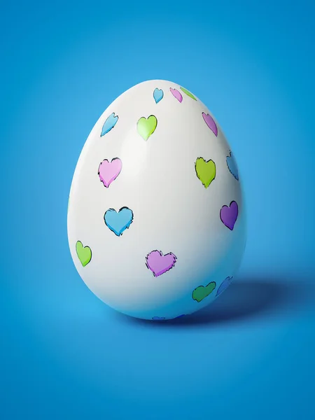 Easter egg with hearts on blue background — Stock Photo, Image