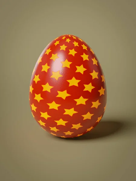 Красное яйцо с изолированными желтыми звездами — стоковое фото