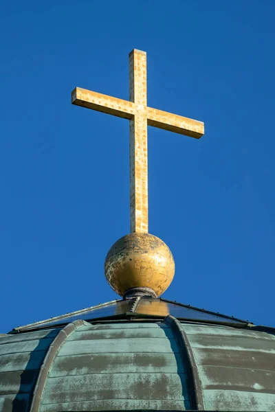 Golden cross on a roof — Stock Photo, Image
