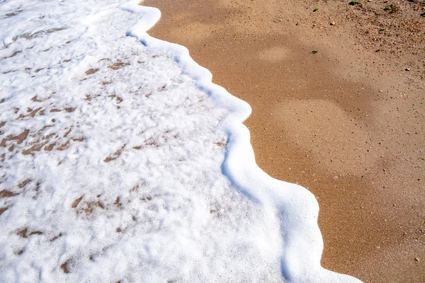 Detalhe da costa na praia de areia na Itália — Fotografia de Stock