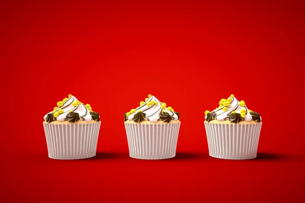 Tres cupcakes sobre fondo rojo — Foto de Stock