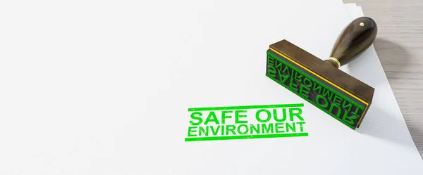 Verde seguro nosso selo ambiental no fundo do livro branco — Fotografia de Stock