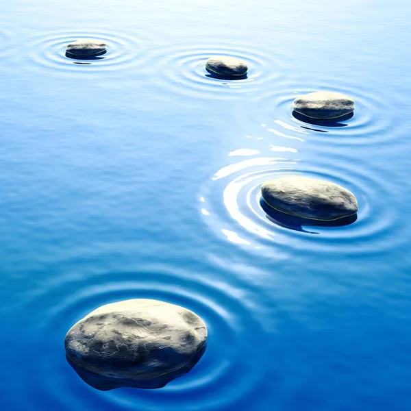 Piedras de guijarro en el agua con fondo ondulado — Foto de Stock