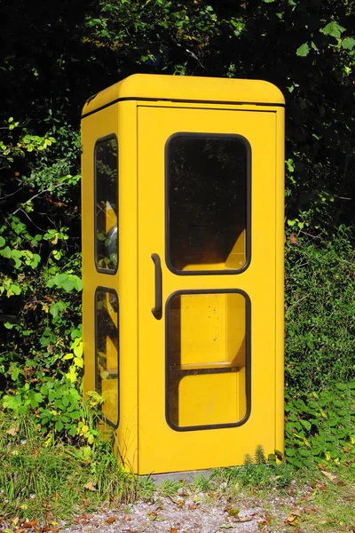 Vintage yellow german phone box — Stock Photo, Image