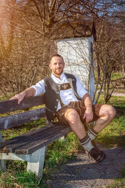 Bavarian tradition man in the grass — Stock Photo, Image