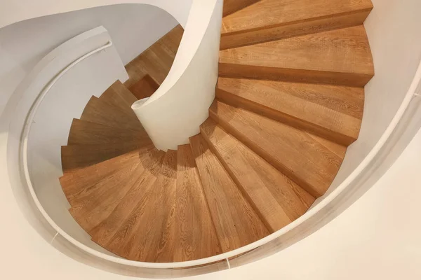 An image of a wooden spiral staircase