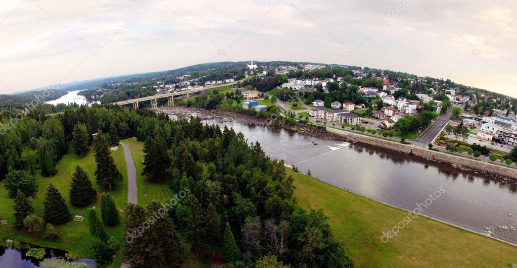Aerial view of harnessed river flowing through town, Alma, Quebec, Canada, panorama fisheye effect