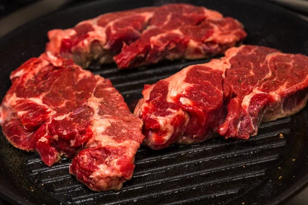 Three Chuck Steaks on Skillet — Stock Photo, Image