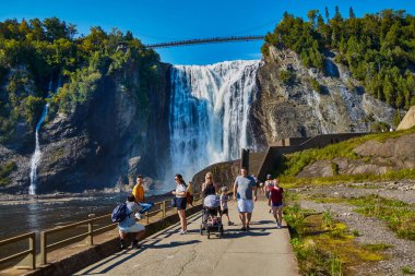 Tourists at Bottom of Montmorency Falls clipart