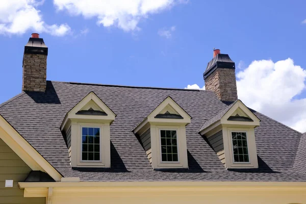 Dormers and Stone Chimneys Stock Image