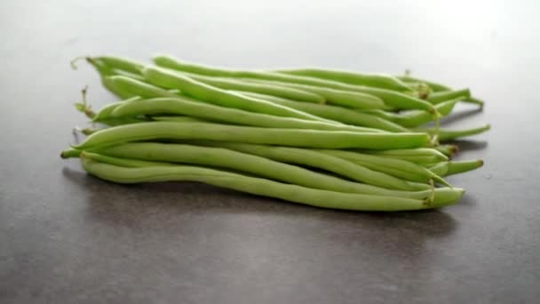 Raw Green French Beans Grey Table Rotating Footage Video — Stock Video