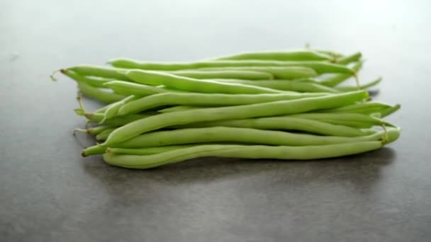 Raw Green French Beans Grey Table Rotating Footage Video — Stock Video