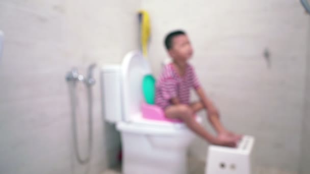 Five Years Old Asian Child Sitting Toilet Bowl Purposely Lens — Stock Video