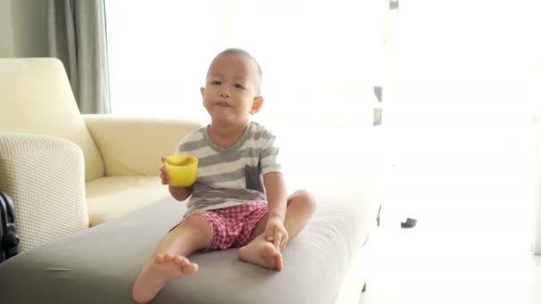 Two Three Years Old Asian Child Eating Cereal Puffs Self — Stock Video