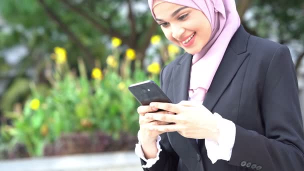 Muslim Business Woman Using Smartphone Smiling — Stock Video