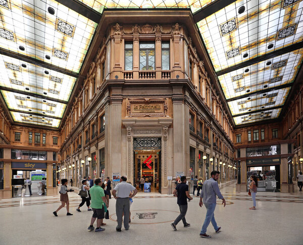 ROME, ITALY - JUNE 30, 2014: Shoppers in Galleria Alberto Sordi Shopping Arcade Interior in Rome, Italy.