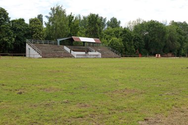 Empty Hippodrome Stadium Stands and Green Grass clipart