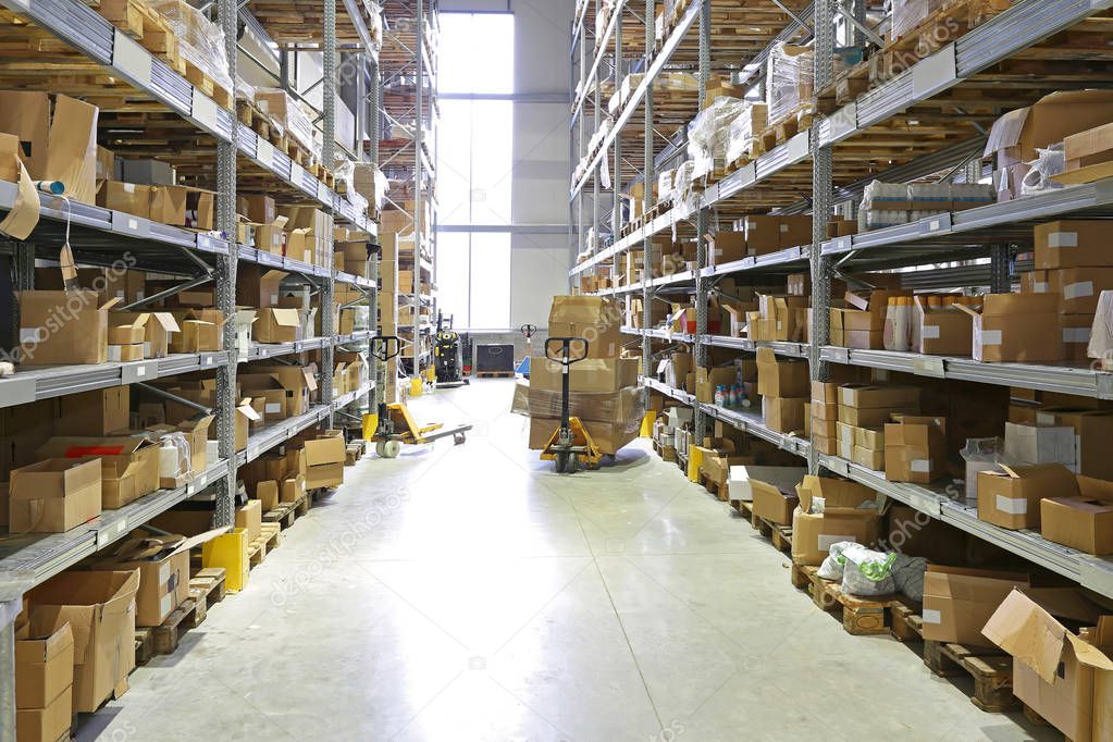 Pallet Jack With Boxes in Fulfillment Warehouse Aisle