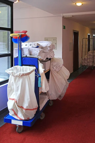 Cleaning Utility Janitor Cart in Hotel Corridor