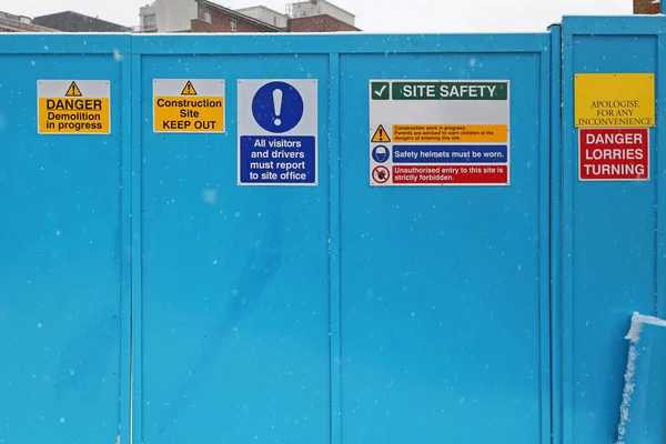 Safety Warning Signs at Construction Site Gate