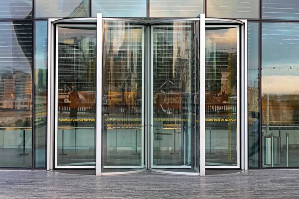 Automatic Revolving Door at Glass Office Building