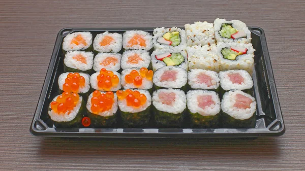 Two Dozen Sushi Rolls Tray Japanese Cuisine Takeaway — Stock Photo, Image