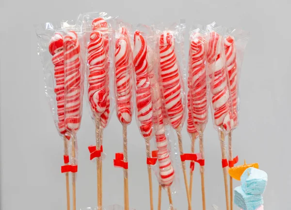 Red and White Sweet Lollipops at Sticks