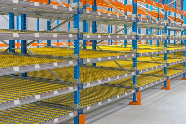 Gravity Flow Rack Shelving in Distribution Warehouse