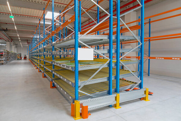 Gravity Flow Rack Shelving in Distribution Warehouse