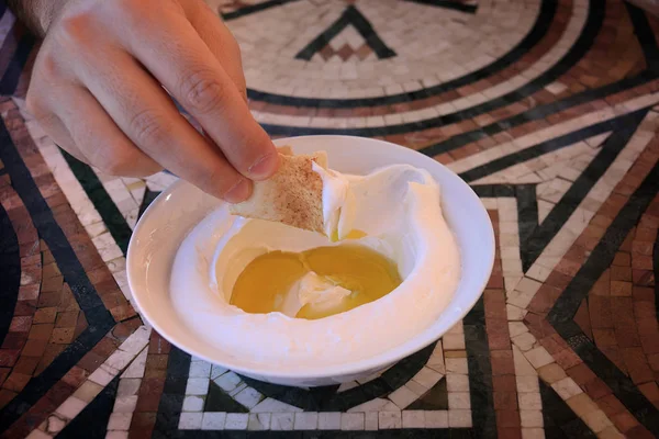 Man Dipping Pita Bread Slice Labneh Plate — Stock Photo, Image